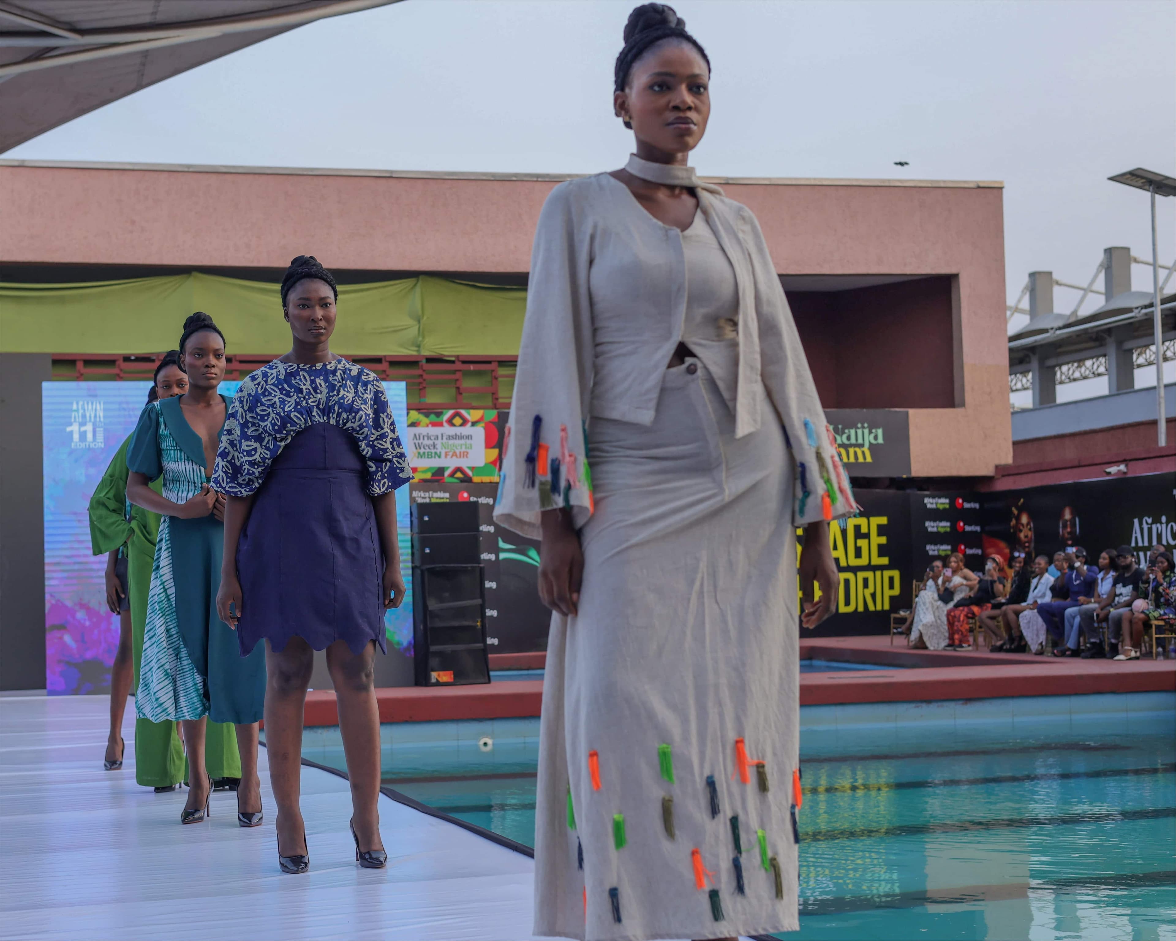 Models walking the poolside runway